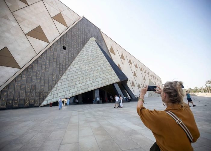 A-wonderful-picture-of-a-woman-in-front-of-the-Grand-Egyptian-Museum